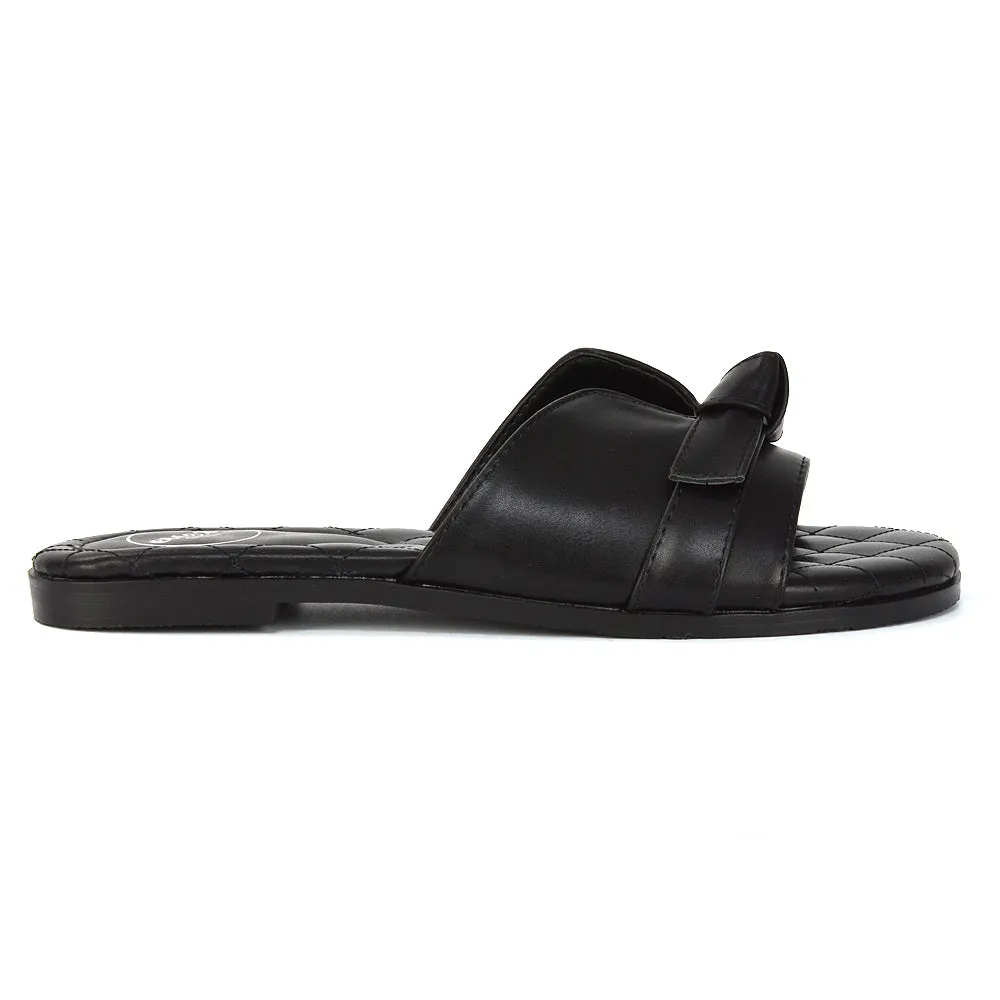 Ariella Cut Out Quilted Insole Bow Flat Slider Sandals in Black Synthetic Leather
