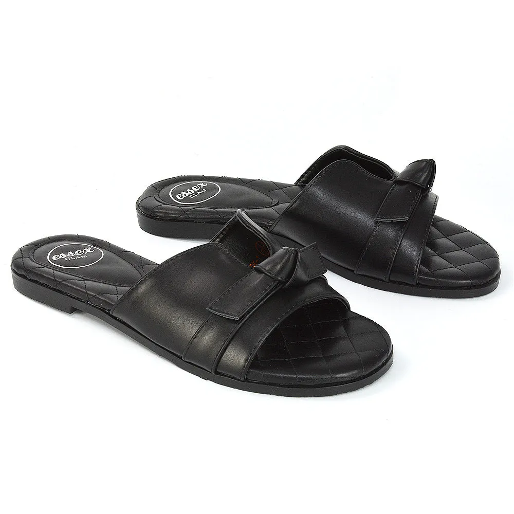 Ariella Cut Out Quilted Insole Bow Flat Slider Sandals in Black Synthetic Leather